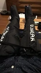 Uploaded photo of full-leg compression boots being worn at home
