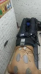 Uploaded photo of full-leg compression boots being worn at home